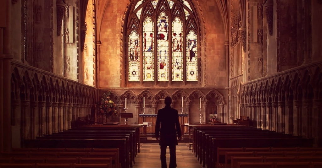 51071-manstandinginchurch.1200w.tn